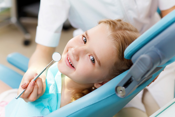 Child getting teeth treatment