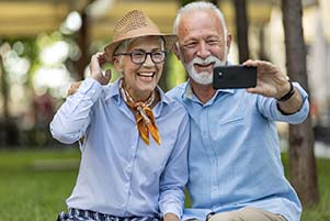 Older Happy Couple is Taking Self Portrait Photography in the Park